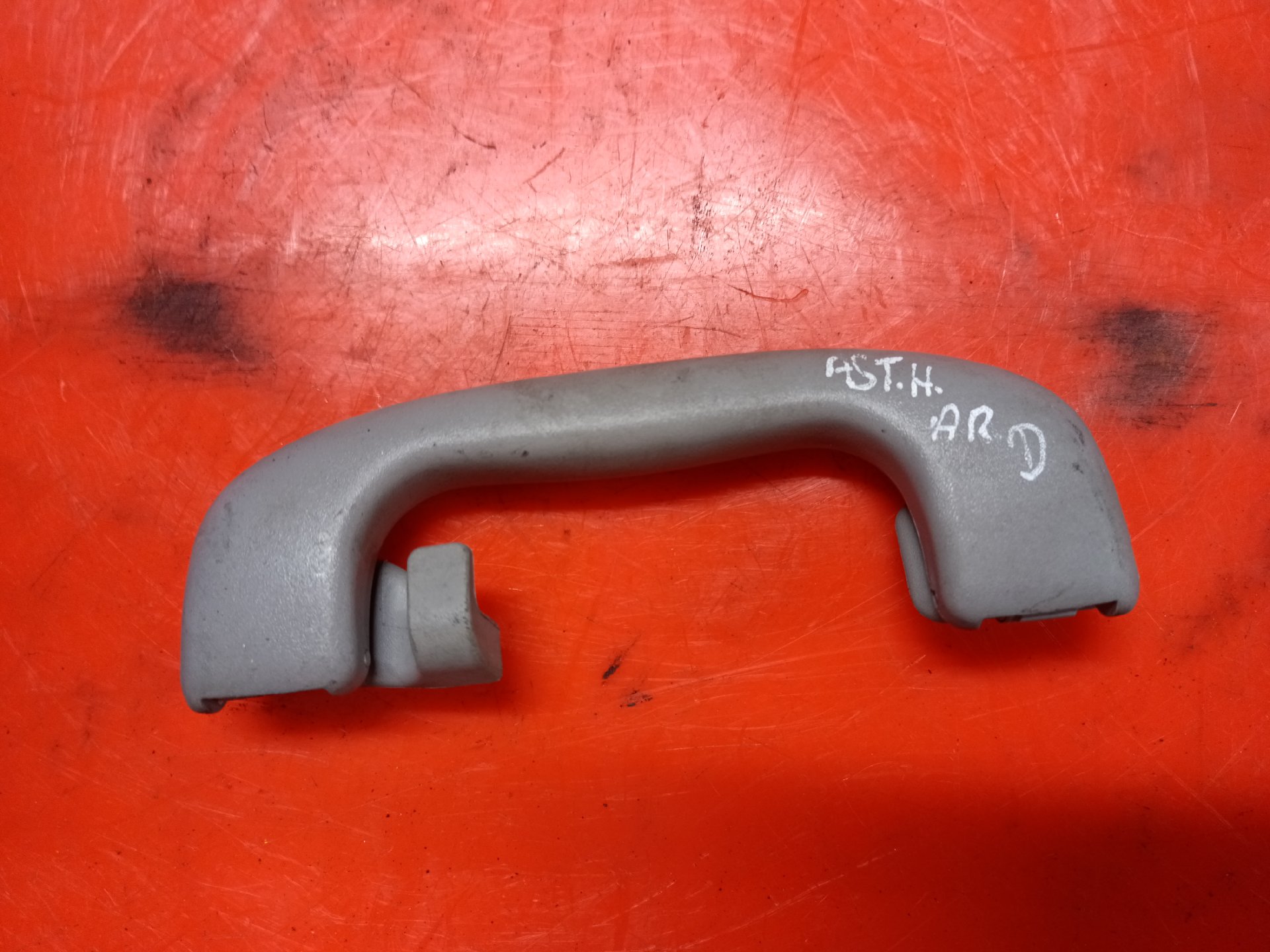 Interior door handle with hook