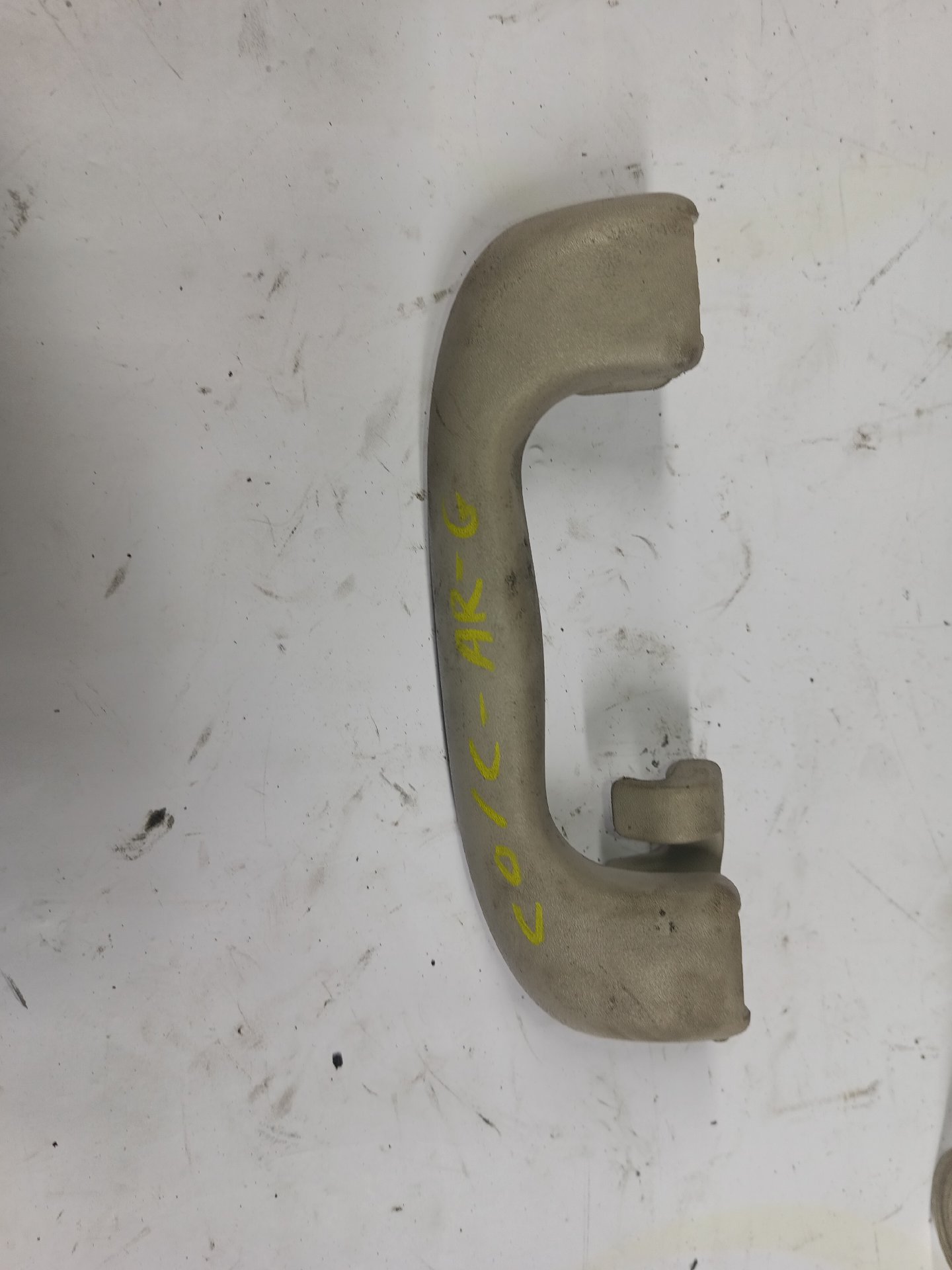 Interior roof grab handle with hook