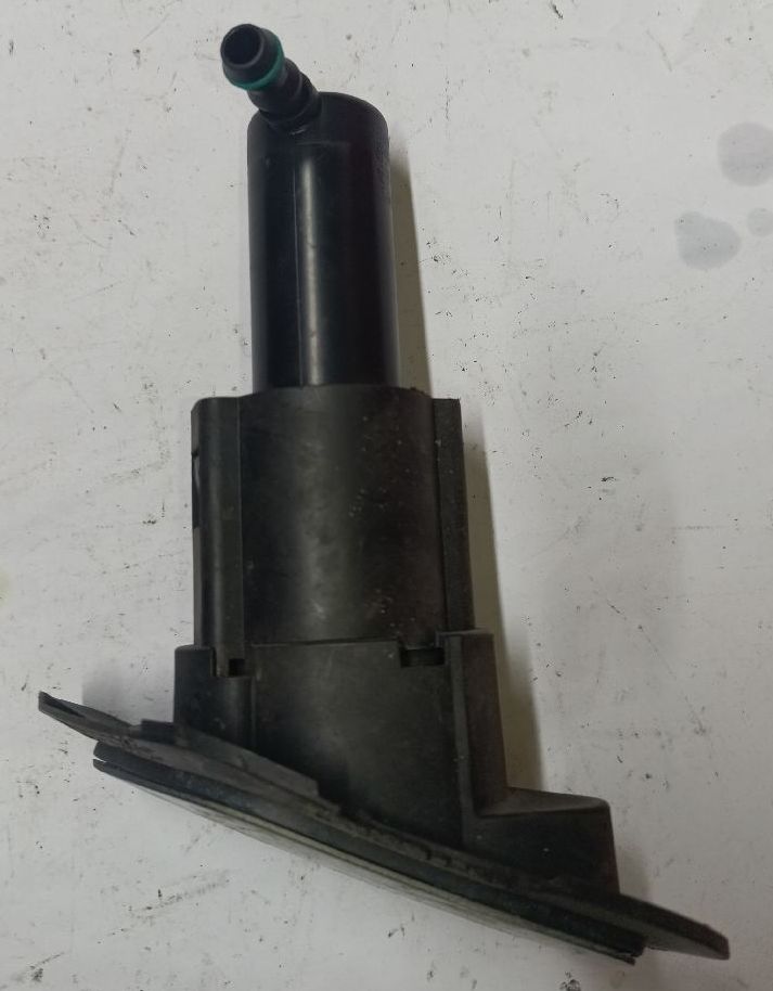 Left headlight washer nozzle