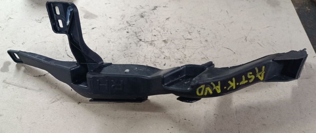 Front headlight support bracket