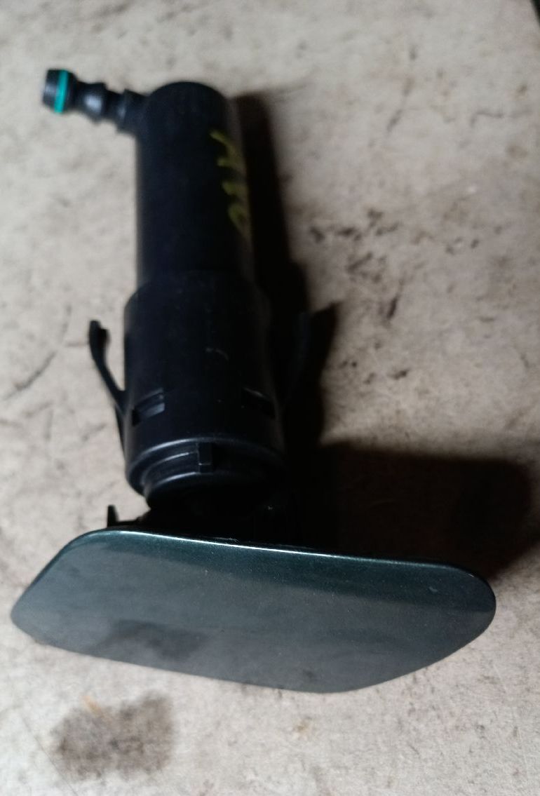 Front left windshield washer nozzle