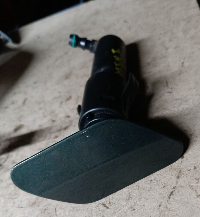 Right front windshield washer nozzle