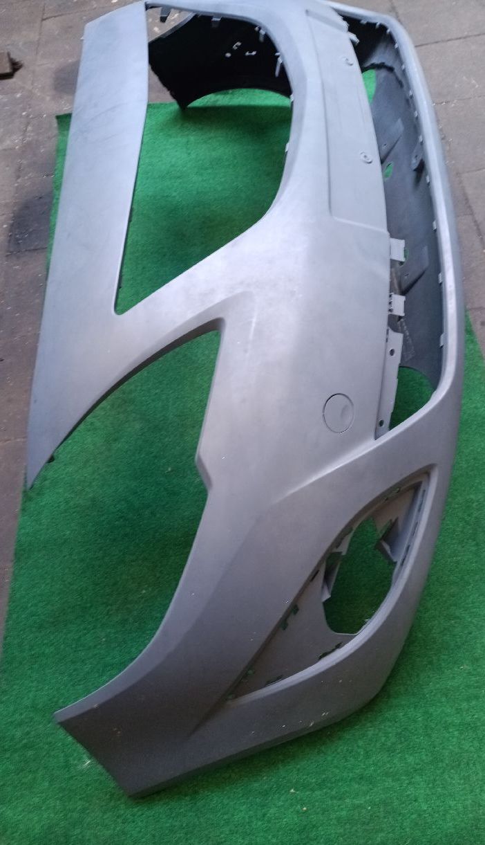 Front bumper, unpainted, without sensors