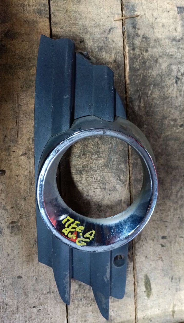 Front left fog light plastic bezel