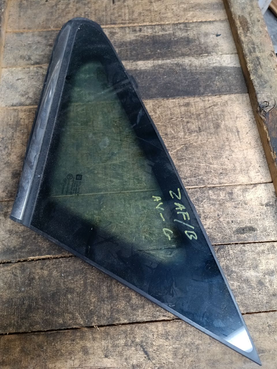 Front left window glass with chrome trim