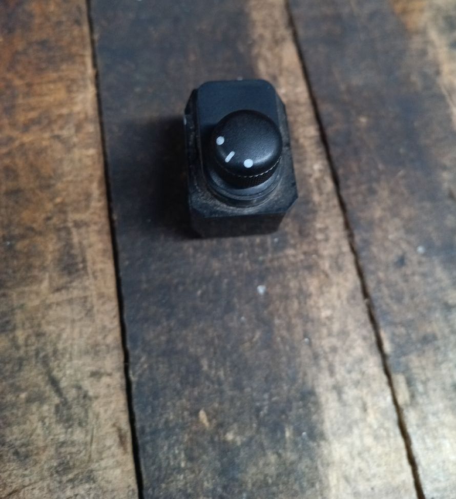 Rearview mirror communicator button