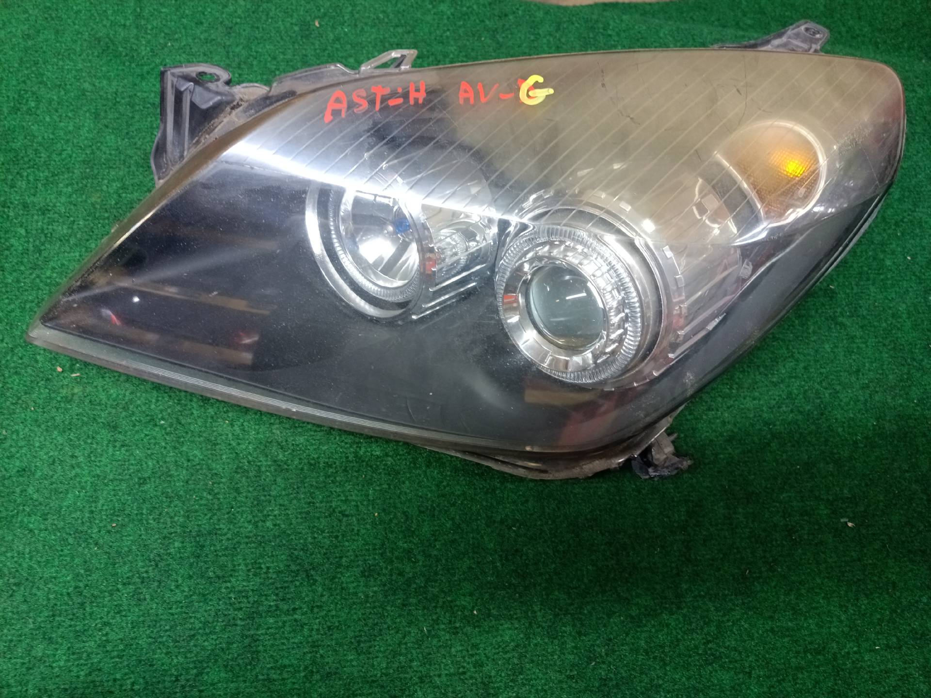 Left front headlight assembly, mounting tab broken - needs repair