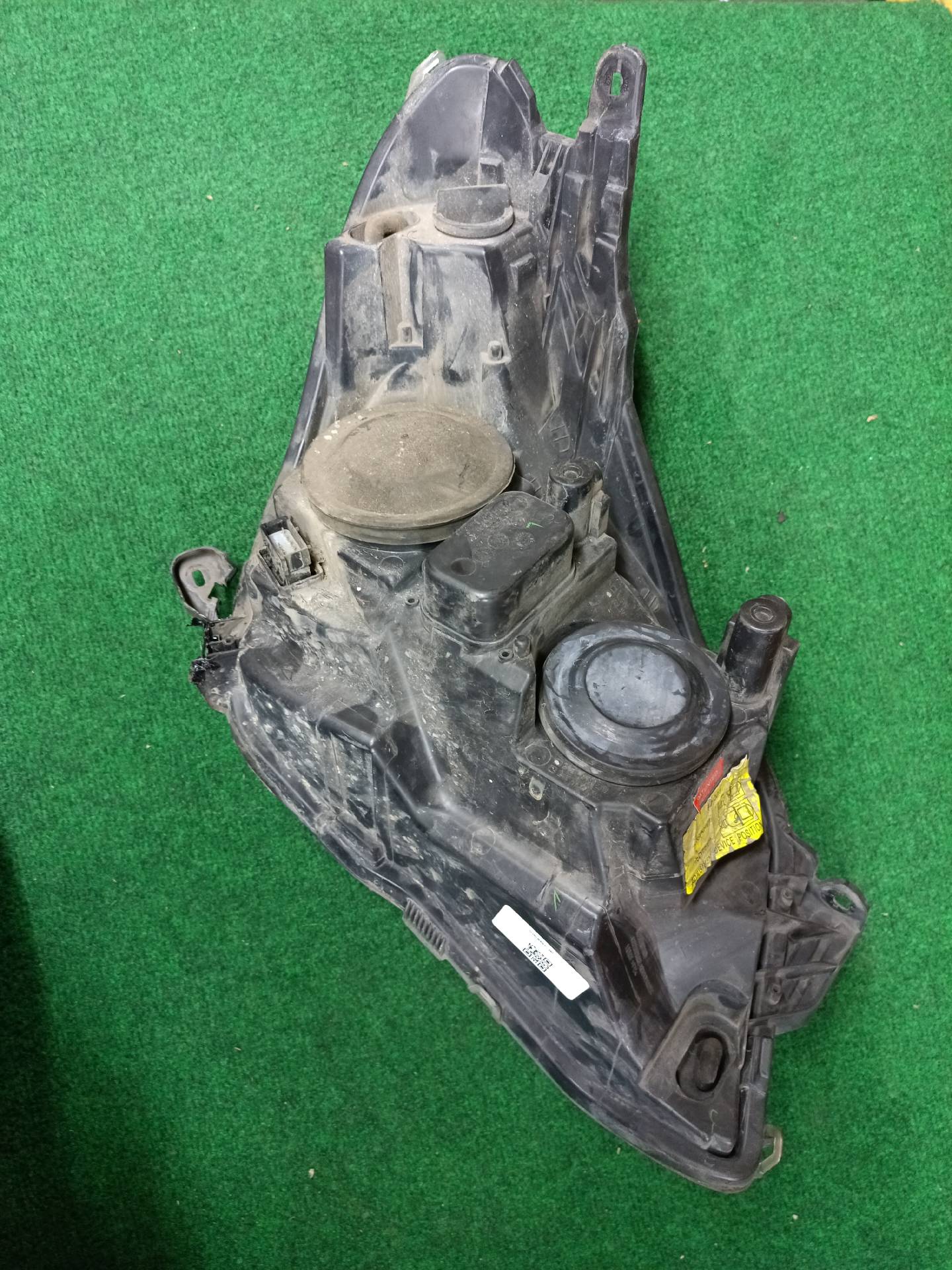 Left front headlight assembly, mounting tab broken - needs repair