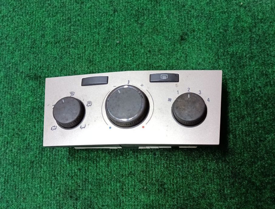 2-button golden-gray climate control knob